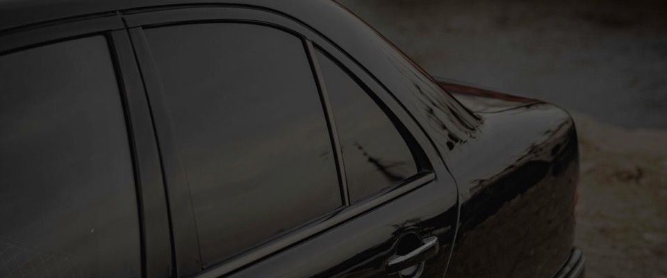 Black sedan with dark ceramic window tint
